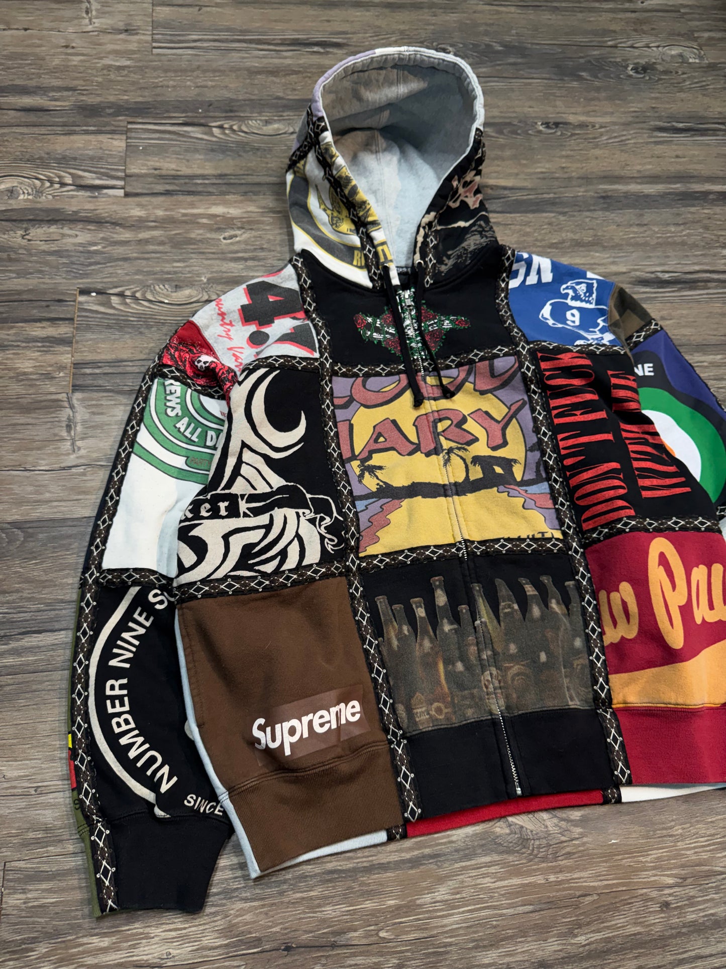 SUPREME NUMBER (N)INE PATCHWORK ZIP-UP HOODIE